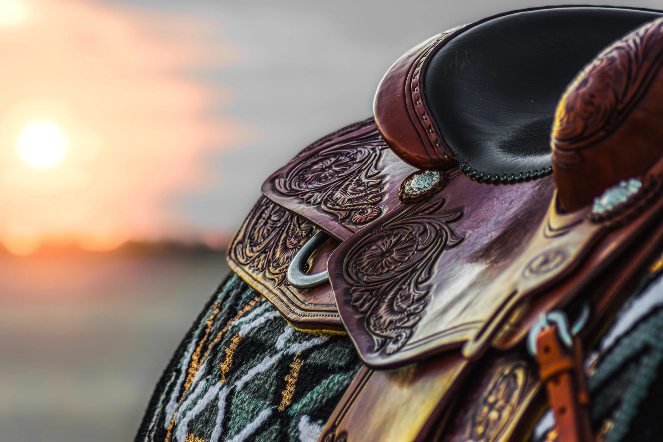Western saddle & sunset