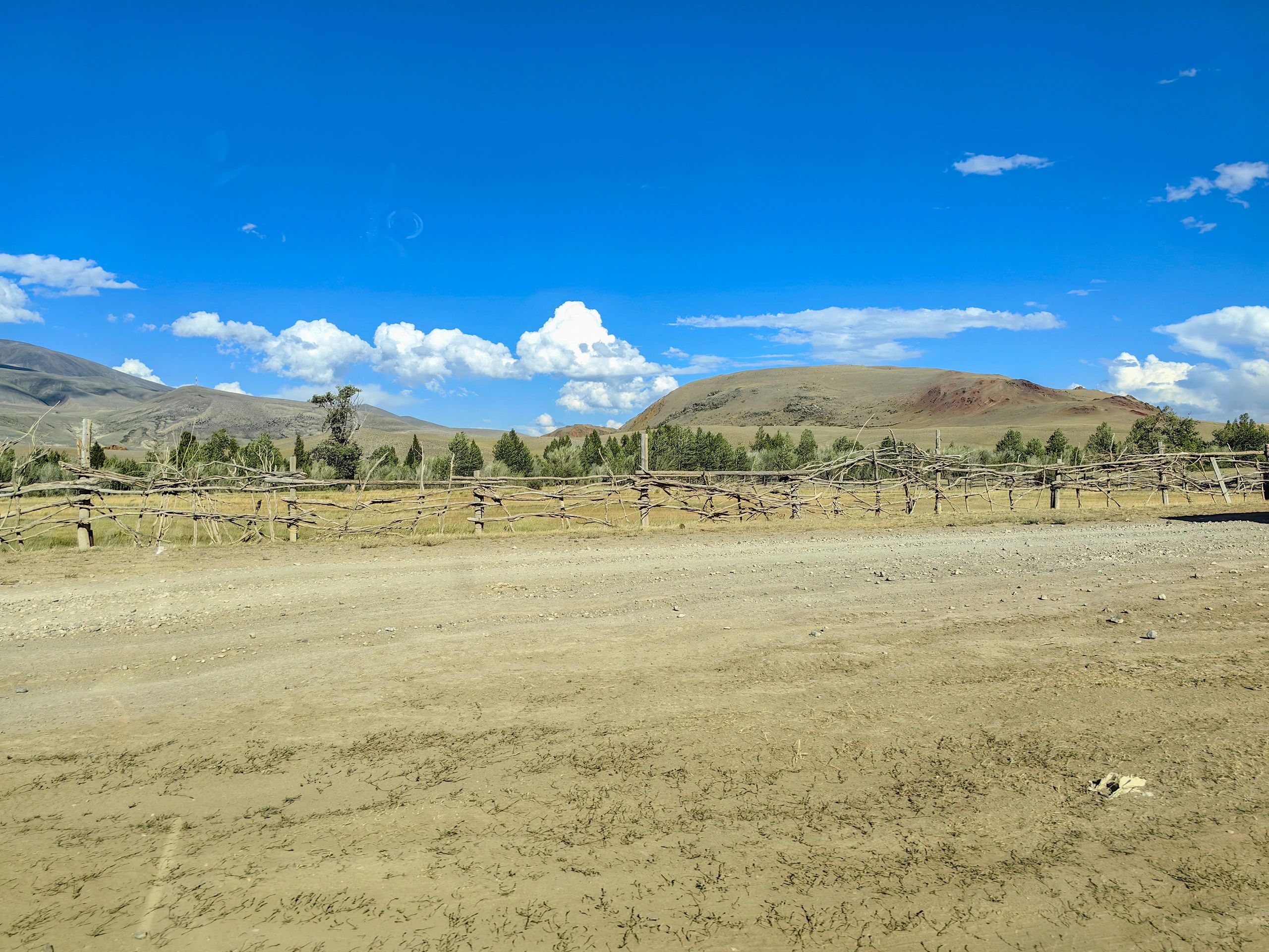 Scenic dirt road leading into open country